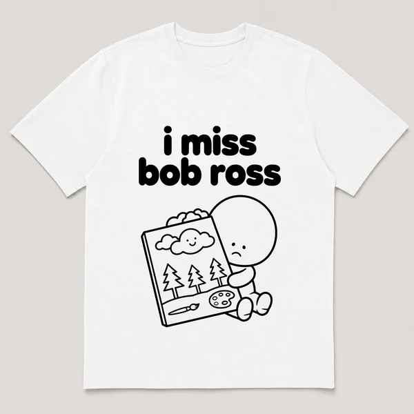 lonely boi tee: a small sad cartoon boy hugging a small canvas with a happy cloud, with the words i miss bob ross above him