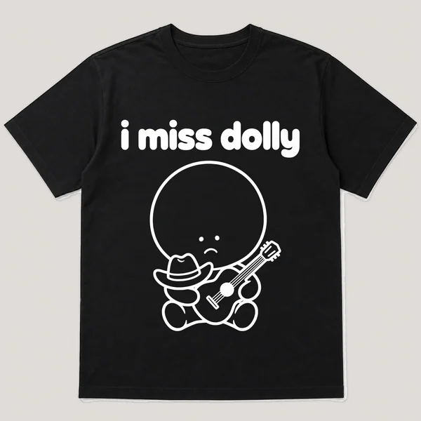 lonely boi tee: a small sad cartoon boy hugging a tiny cowboy hat and a guitar, with the words i miss dolly above him