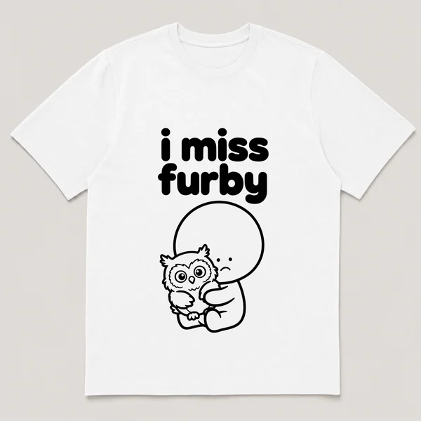 lonely boi tee: a small sad cartoon boy hugging a wide-eyed furry owl-like toy, with the words i miss furby above him
