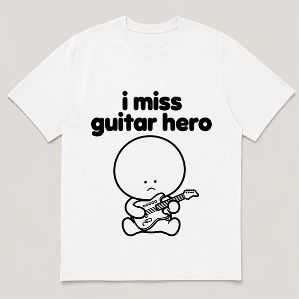 lonely boi tee: a small sad cartoon boy hugging a small plastic guitar controller, with the words i miss guitar hero above him