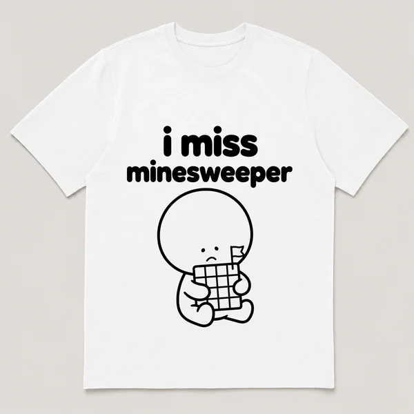 lonely boi tee: a small sad cartoon boy hugging a grid of gray tiles with a flag, with the words i miss minesweeper above him