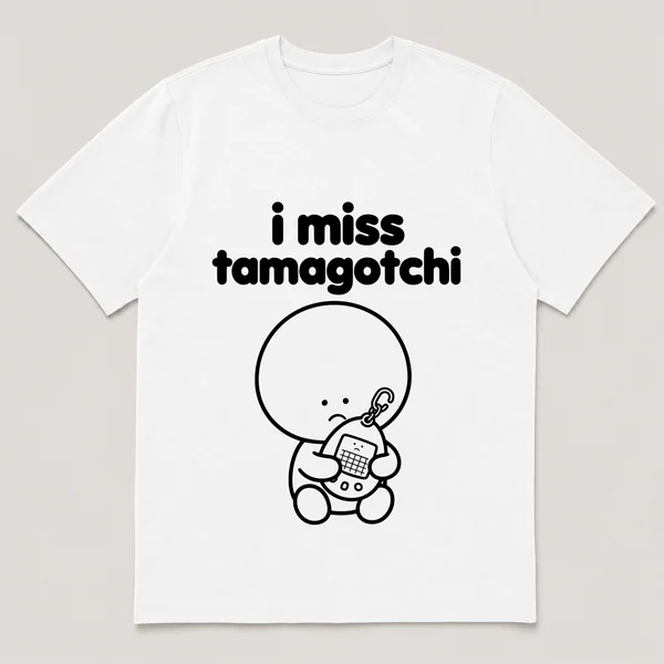 lonely boi tee: a small sad cartoon boy hugging an egg-shaped virtual pet keychain, with the words i miss tamagotchi above him