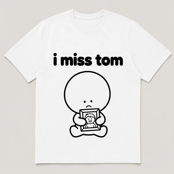 lonely boi tee: a small sad cartoon boy hugging a framed photo of a smiling friend, with the words i miss tom above him