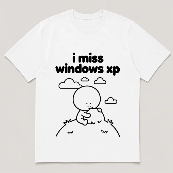 lonely boi tee: a small sad cartoon boy hugging a green hill under a blue sky, with the words i miss windows xp above him